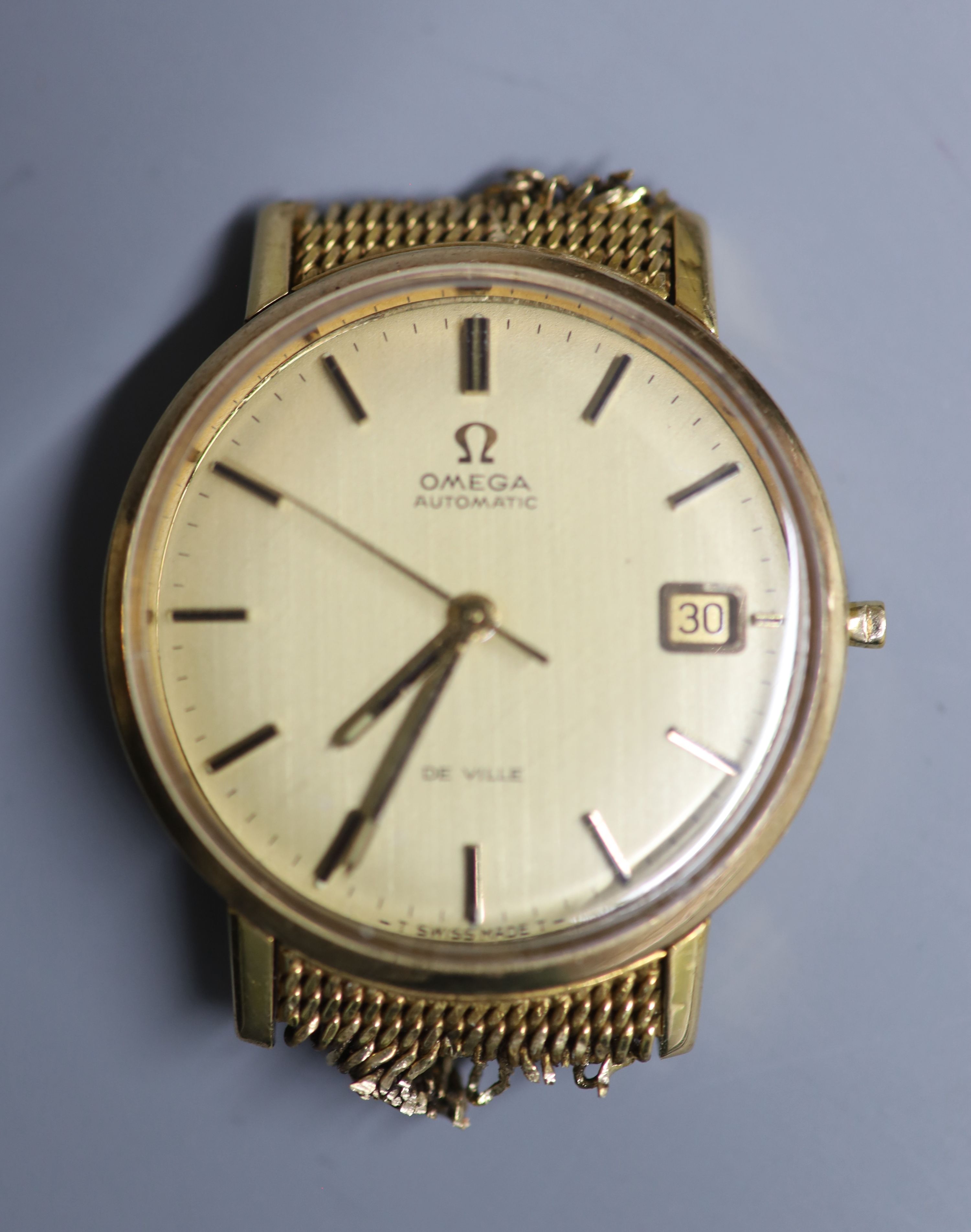 A gentlemans yellow metal Omega automatic wrist watch, now without bracelet and winding crown,